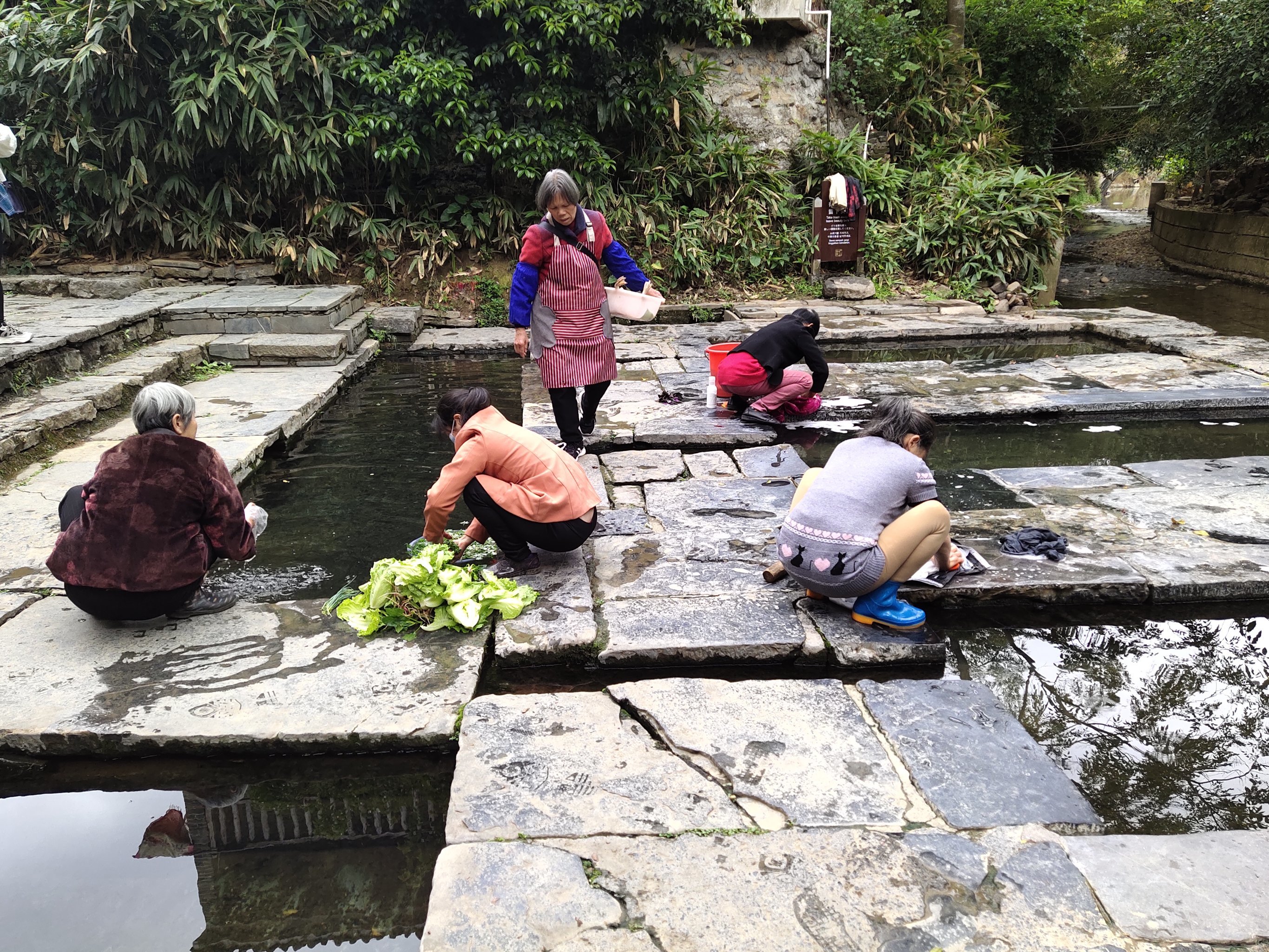 Immortal Ancient Well in Huangyao Ancient Town, consisting of five connected wells with clear water, each with its own purpose