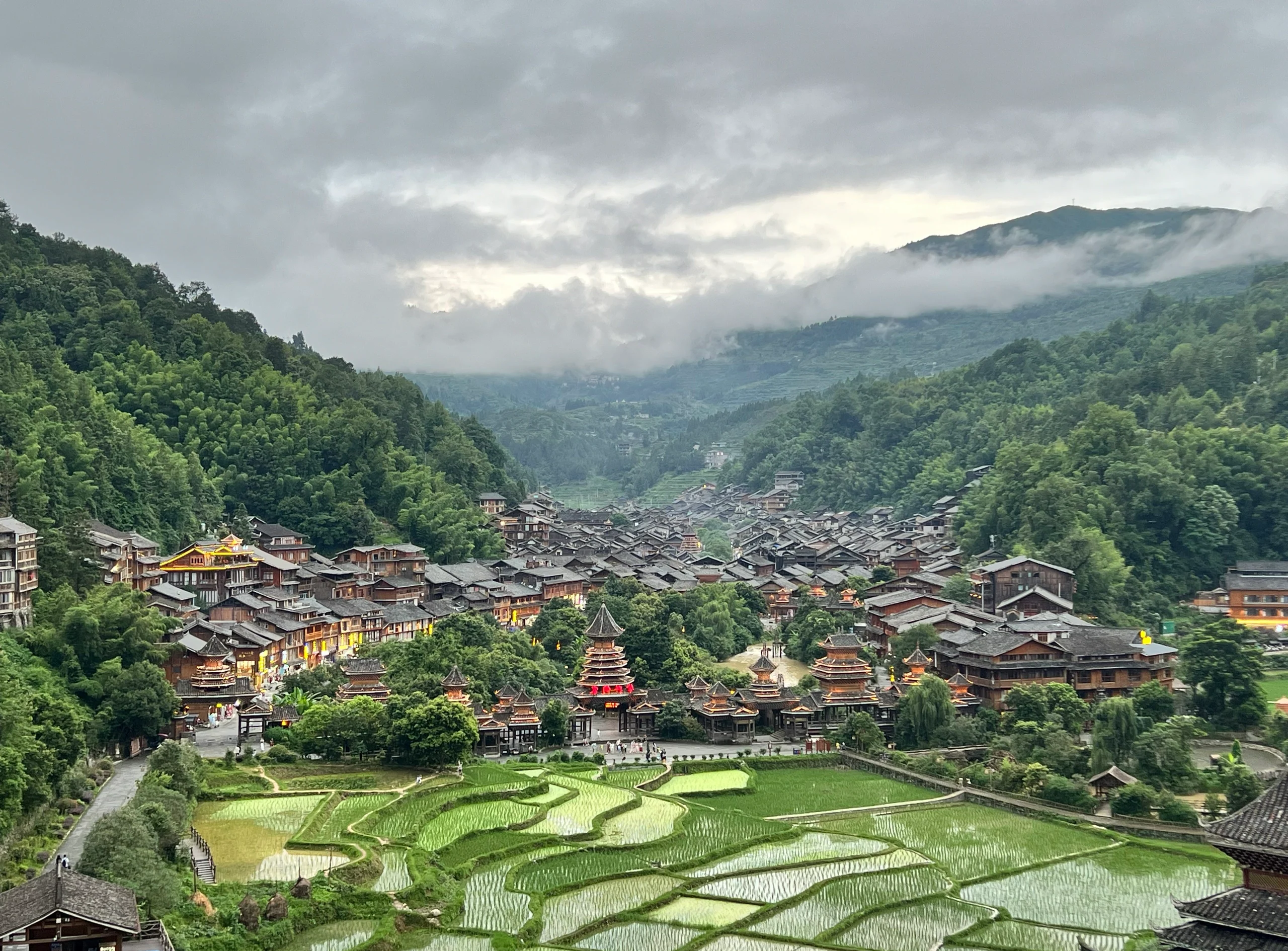 Tang'an Dong Village and terraced fields, with the village and layered terraces among clouds and mist