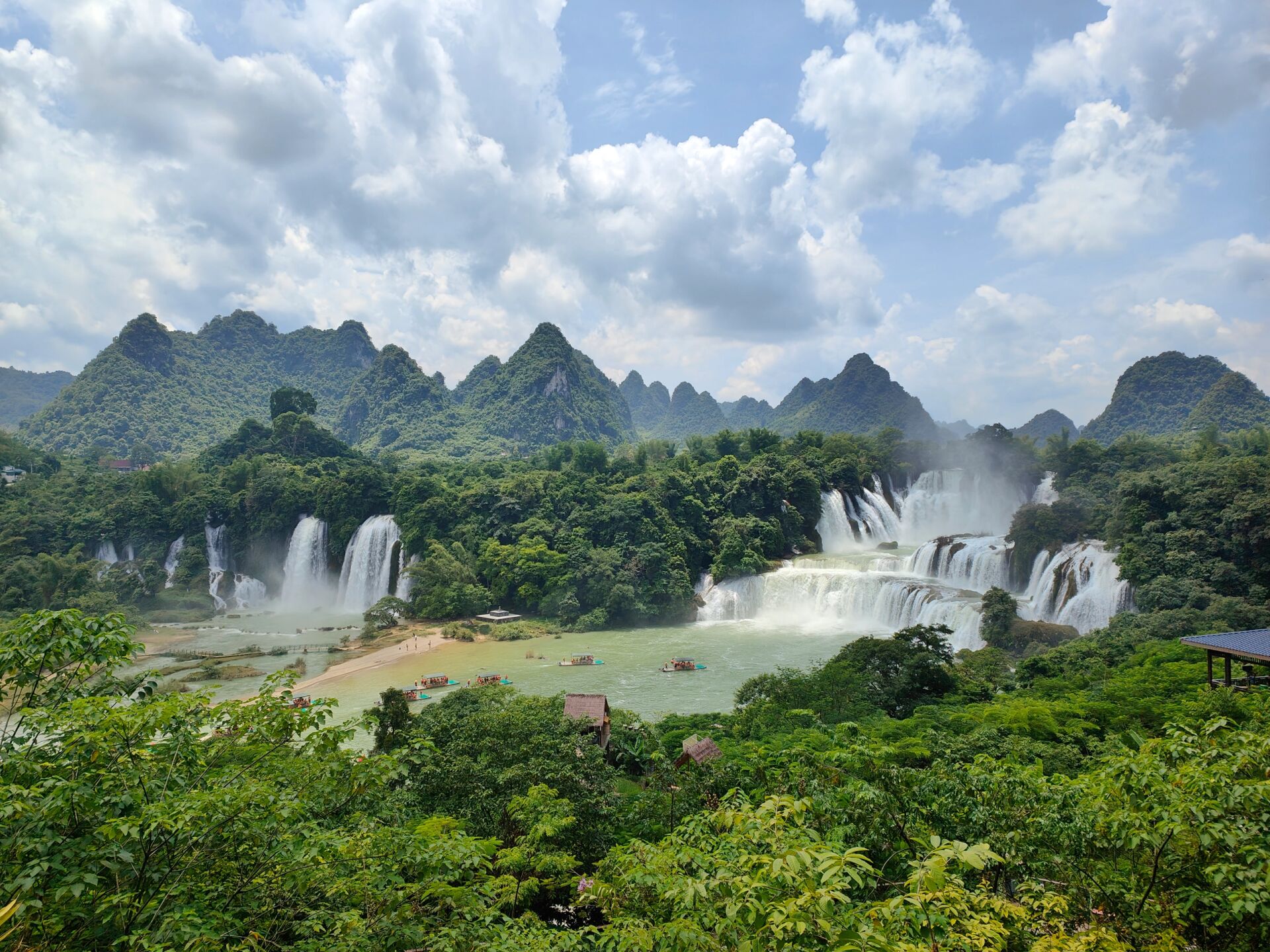 Panoramic view of Detian Transnational Waterfall, with three-tiered cascades and magnificent momentum