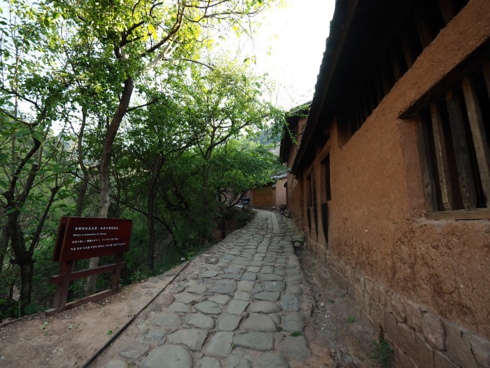 Nuodeng Tea Horse Road relics with clear horse hoof prints visible on the stone path