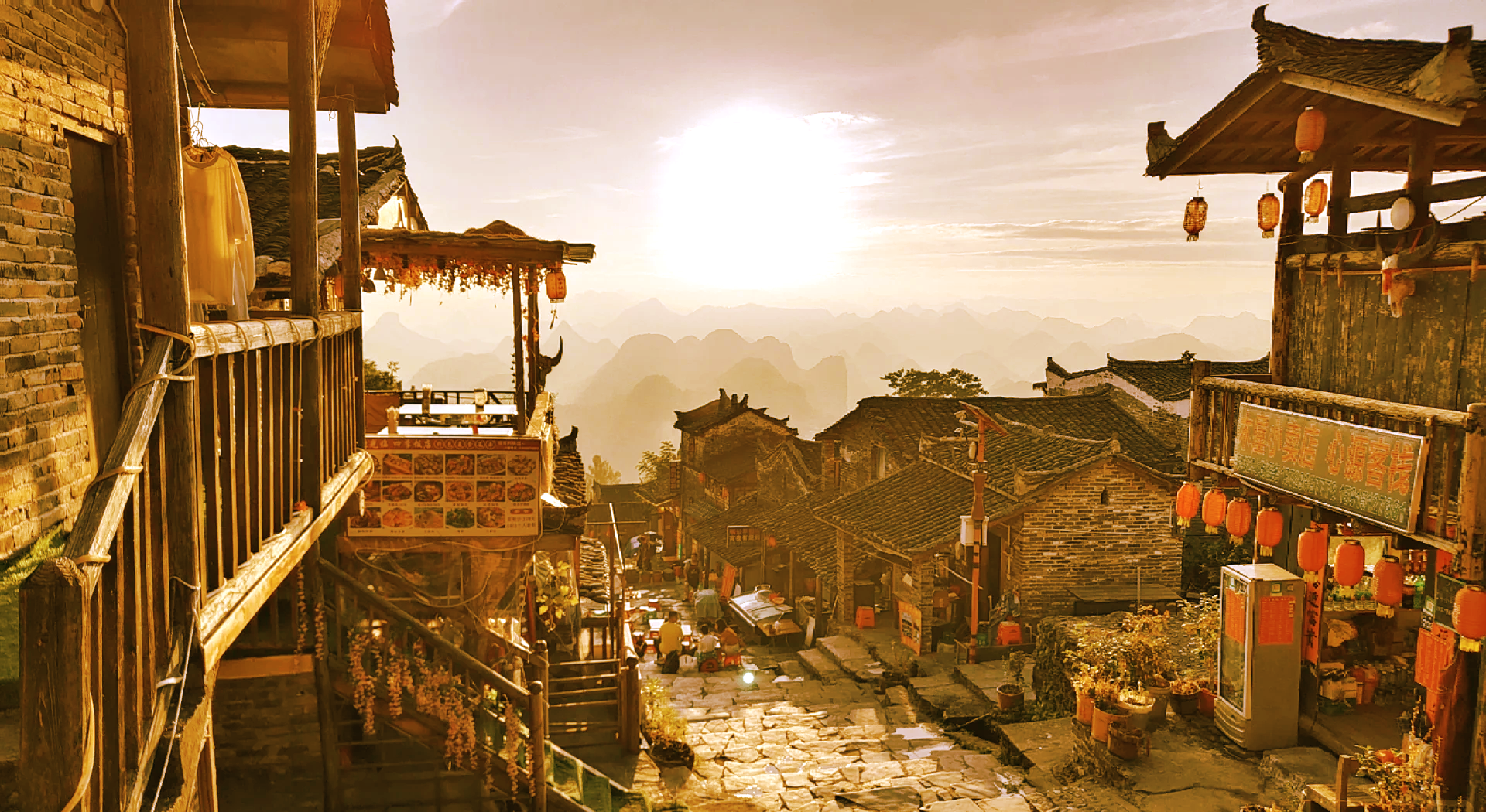 Morning at Liannan Yao Village, sunlight shining on the layered stilt houses